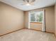 Cozy bedroom with neutral walls, soft carpet, and a bright window providing ample natural light at 20922 E Crestline Cir, Centennial, CO 80015