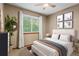Cozy bedroom with a comfortable bed, natural light from the window, and stylish decorative touches at 20922 E Crestline Cir, Centennial, CO 80015