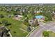 An aerial view highlights community amenities, including a pool, playground, and green spaces in a Gathering-friendly neighborhood at 20922 E Crestline Cir, Centennial, CO 80015
