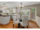Bright open dining area with hardwood floors and kitchen view at 20922 E Crestline Cir, Centennial, CO 80015