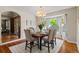 Elegant dining room featuring a wooden table, upholstered chairs, and a chandelier, ideal for Gathering gatherings at 20922 E Crestline Cir, Centennial, CO 80015
