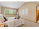 Bedroom featuring a vaulted ceiling, carpet floors, and a large window at 20922 E Crestline Cir, Centennial, CO 80015