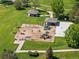Aerial view of a well-maintained playground with slides, swings, and play structures in a green park setting at 20922 E Crestline Cir, Centennial, CO 80015