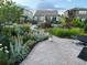 Manicured backyard featuring lush greenery, a patio, and string lights at 1715 Pioneer Cir, Lafayette, CO 80026