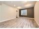 Spacious basement with stylish floors, recessed lighting, and ample natural light at 1715 Pioneer Cir, Lafayette, CO 80026