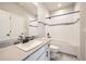 Bright bathroom featuring a vanity, toilet, modern fixtures, and a combined tub and shower at 1715 Pioneer Cir, Lafayette, CO 80026