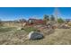 Attractive community entrance sign at Trails at Coal Creek, nestled among stacked stone and landscaping at 1715 Pioneer Cir, Lafayette, CO 80026