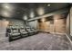 Dedicated home theater with plush seating and stylish, ambient lighting at 1715 Pioneer Cir, Lafayette, CO 80026