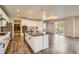 Well-lit kitchen features a central island with modern appliances and open concept dining area at 1715 Pioneer Cir, Lafayette, CO 80026