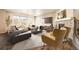 Bright, spacious living room features large windows, modern decor and a cozy fireplace at 1715 Pioneer Cir, Lafayette, CO 80026