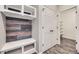 Mud room with custom built-in bench and storage area located by the entryway at 1715 Pioneer Cir, Lafayette, CO 80026