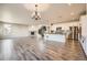 Expansive open floorplan features a fireplace, kitchen with island, and staircase at 1715 Pioneer Cir, Lafayette, CO 80026