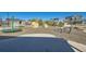 Community playground with climbing and play structures surrounded by landscaped grounds and homes at 1715 Pioneer Cir, Lafayette, CO 80026