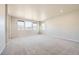 Spacious room with ample natural light from multiple windows and neutral carpeting at 1715 Pioneer Cir, Lafayette, CO 80026