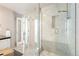 Modern bathroom with marble walk-in shower, tiled floors, and ample counter space at 2000 Little Raven St # 501, Denver, CO 80202