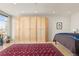 Bedroom with large wardrobes, wood floors, and view from the window at 2000 Little Raven St # 501, Denver, CO 80202