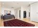 Spacious bedroom features an inviting king-sized bed, hardwood floors, and a large decorative rug at 2000 Little Raven St # 501, Denver, CO 80202