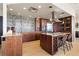 Modern kitchen with stainless steel appliances, custom backsplash, hardwood floors and granite countertops at 2000 Little Raven St # 501, Denver, CO 80202