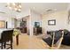 Inviting living space featuring hardwood floors, comfortable seating, and seamless transition to the kitchen at 2000 Little Raven St # 501, Denver, CO 80202