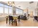 Spacious living room features a dining table, fireplace and large windows with city views at 2000 Little Raven St # 501, Denver, CO 80202