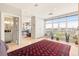 Bright living room with a large window overlooking city views, with hardwood floors and potted plants at 2000 Little Raven St # 501, Denver, CO 80202