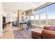 Bright home office with large windows and city views is open to the living area at 2000 Little Raven St # 501, Denver, CO 80202