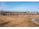 An expansive park view with manicured grass, meandering pathways, and city views at 2000 Little Raven St # 501, Denver, CO 80202