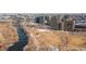 An aerial view showcasing an open park area with walking paths and natural landscaping with building in the background at 2000 Little Raven St # 501, Denver, CO 80202