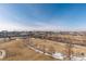 Scenic park view featuring walking trails, grassy areas, and distant urban skyline views at 2000 Little Raven St # 501, Denver, CO 80202