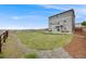 Expansive backyard with lush greenery, a well-maintained lawn, and a patio area, perfect for outdoor activities at 4811 River Highlands Loop, Elizabeth, CO 80107