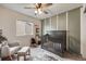 Cozy Bedroom with a wood crib, soft lighting, and playful decor, creating a warm and inviting space at 4811 River Highlands Loop, Elizabeth, CO 80107