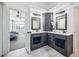 Double vanity in bath with gray cabinets, marble countertops, and modern fixtures at 5547 S Urban St, Littleton, CO 80127