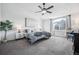 Bright bedroom with a ceiling fan, large window and neutral decor at 5547 S Urban St, Littleton, CO 80127