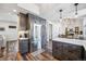 Modern kitchen features stainless steel refrigerator and view of the living and dining area at 5547 S Urban St, Littleton, CO 80127