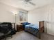 Bedroom featuring carpeted flooring, bright light from the window, neutral walls, and a ceiling fan at 13577 Quivas St, Denver, CO 80234
