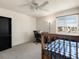 Comfortable bedroom with carpet, a window providing natural light, and a ceiling fan for ventilation at 13577 Quivas St, Denver, CO 80234