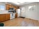 Bright kitchen featuring ample counter space, practical appliances, and a cozy atmosphere at 13577 Quivas St, Denver, CO 80234