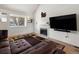 Bright living room featuring a fireplace, large window, and open layout perfect for relaxing at 13577 Quivas St, Denver, CO 80234