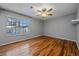 Bedroom featuring hardwood floors, natural light, and gray painted walls at 2761 S Xanadu Way, Aurora, CO 80014