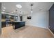 Modern kitchen with dark cabinets, granite countertops, stainless steel appliances, and island seating at 2761 S Xanadu Way, Aurora, CO 80014