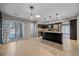 Spacious kitchen with dark wood cabinets, granite countertops, and stainless steel appliances at 2761 S Xanadu Way, Aurora, CO 80014