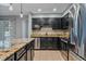 Modern kitchen featuring stainless steel appliances and dark wood cabinets at 2761 S Xanadu Way, Aurora, CO 80014