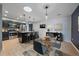 Modern eat-in kitchen featuring stainless appliances, a skylight, granite countertops and black cabinetry at 2761 S Xanadu Way, Aurora, CO 80014