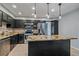 Kitchen with a large island, stainless steel appliances, granite countertops, and sleek cabinetry at 2761 S Xanadu Way, Aurora, CO 80014