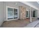 Covered patio area with sliding glass doors and room for outdoor seating or potted plants at 2761 S Xanadu Way, Aurora, CO 80014