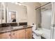 Clean bathroom with granite counters, a large mirror, and a shower/tub combo at 3370 Cascina Cir # D, Highlands Ranch, CO 80126