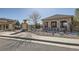 A community pool entrance with beautiful landscaping and decorative pillars at 3370 Cascina Cir # D, Highlands Ranch, CO 80126
