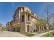 Beautiful stucco townhome with stone accents, a private balcony, and an attached two-car garage at 3370 Cascina Cir # D, Highlands Ranch, CO 80126