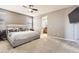 This is a spacious main bedroom with a ceiling fan, and it has an en suite bathroom at 3370 Cascina Cir # D, Highlands Ranch, CO 80126
