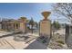 A gated entrance to the community pool, framed by decorative pillars and landscaping at 3370 Cascina Cir # D, Highlands Ranch, CO 80126